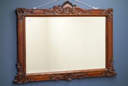 Carved hardwood framed overmantel mirror with bevelled glass,