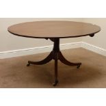 Regency style mahogany dining table, oval folding top on three splay legs, L145cm,