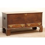 Late 18th century oak mule chest, hinged lid, two drawers, on tall bracket feet, W138cm, H75cm,