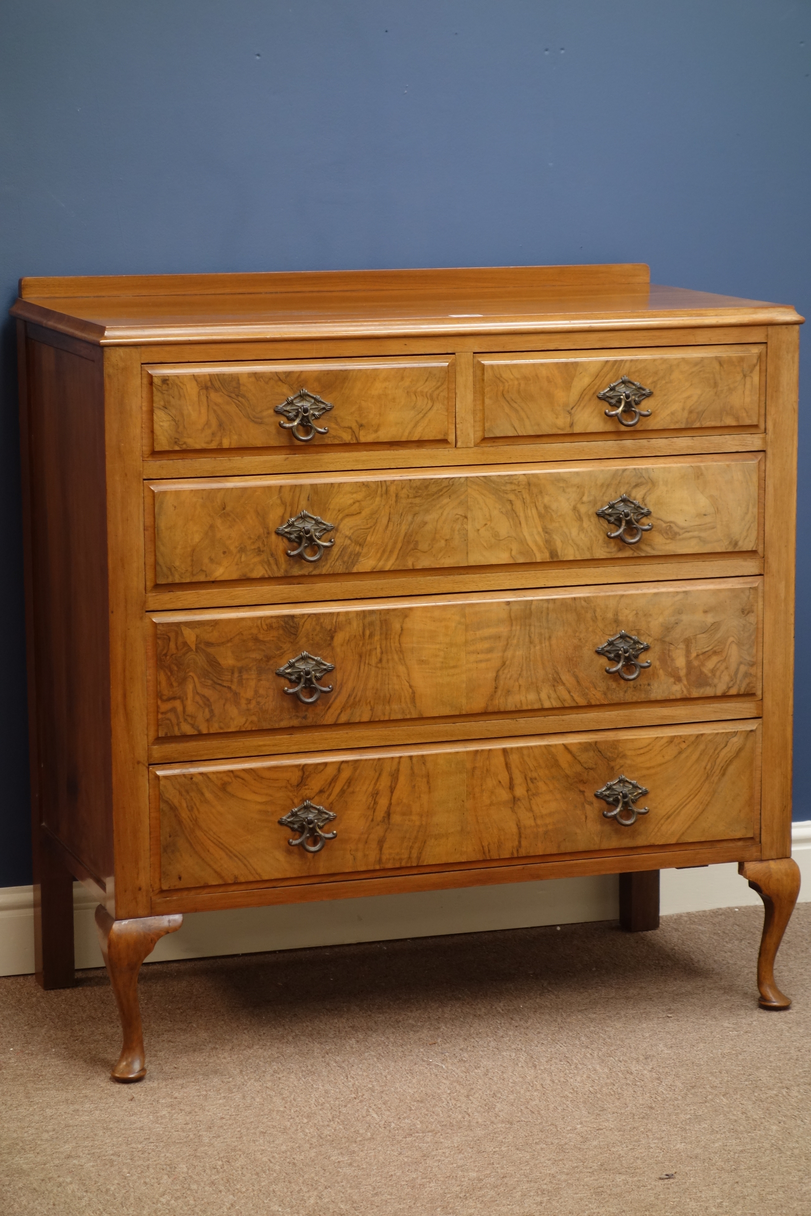 Figured walnut chest of two short and three long drawers on cabriole legs, W93cm,