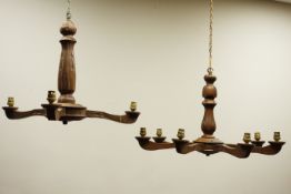 20th century carved oak seven branch chandelier and a similar three branch chandelier