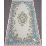 Small Chinese washed woollen cream ground rug,