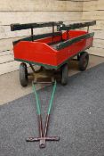 Red and green painted wooden four wheel hand cart,