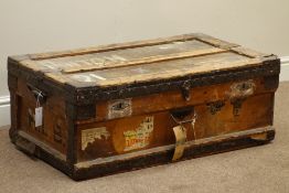 Early 20th century wooden and metal bound travelling trunk, zinc lined, with travel labels, W92cm,