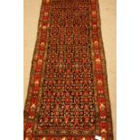Iranian Veramin red ground runner rug, repeating herati motif,