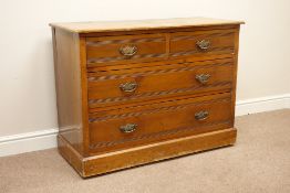Edwardian walnut chest fitted with two short and two long drawers,