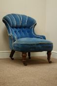 Victorian walnut framed nursing chair upholstered in buttoned blue velvet,