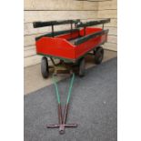 Red and green painted wooden four wheel hand cart,