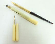 Dip pen with yellow metal and polished stone top,
