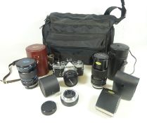 Olympus OM-2 SLR camera with 50mm lens, Olympus 75-150mm lens,