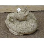 Garden ornament of two piglets