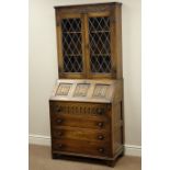 Medium oak bureau bookcase, fall front with linen fold detail, raised lead glazed bookcase,