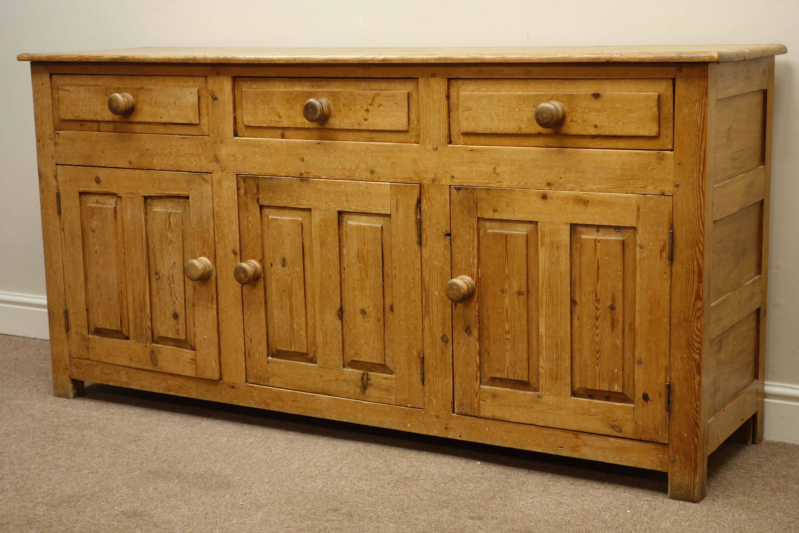 19th century pine dresser base with three drawers and three panelled cupboards, W163cm, H81cm,