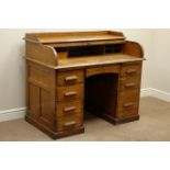 Early 20th century oak tambour roll top desk, eight drawers, W123cm, H101cm,