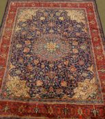 Persian Kashan red and blue ground rug carpet, with interlacing design, large central medallion,