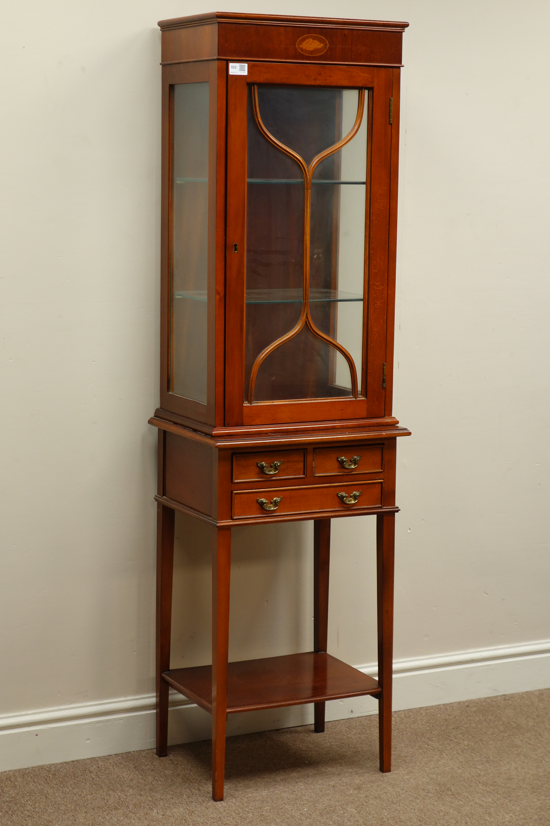 Small reproduction mahogany finish display cabinet on stand,