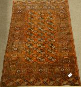 Persian Bokhara pale red ground rug,