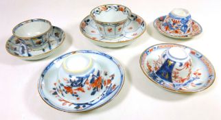 Five 19th Century Chinese tea bowls and saucers decorated in blue and iron red (5)