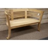 Teak garden bench with contemporary shaped back,