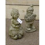 Two composite stone garden gnome figures