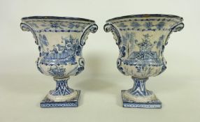 Pair of 19th Century Delft urn shaped vases with Chinoiserie decoration, H17.