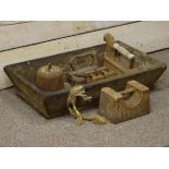 Wooden food trough and various weights and irons