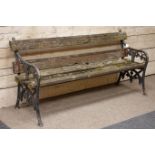 Victorian ornate cast iron and wood slatted garden bench,