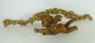 Early 19th Century carved pitch pine Cherub carrying a torch L44cm and a similar age pine European
