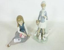 Two Lladro figurines; girl with geese and a seated girl with flowers,
