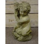 Composite stone putto and dolphin water feature,