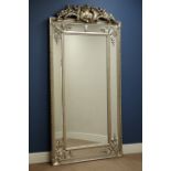 Large full length French style wall mirror in silvered frame with ornate pediment and stepped frame