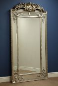 Large full length French style wall mirror in silvered frame with ornate pediment and stepped frame