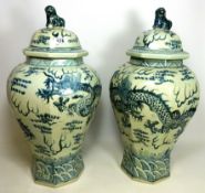 Pair of large 20th Century Chinese blue and white hexagonal baluster vases decorated with dragons,