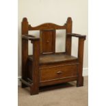 Early 20th century oak hall bench, with hinged seat, umbrella and stick stands, W85cm, H92cm,