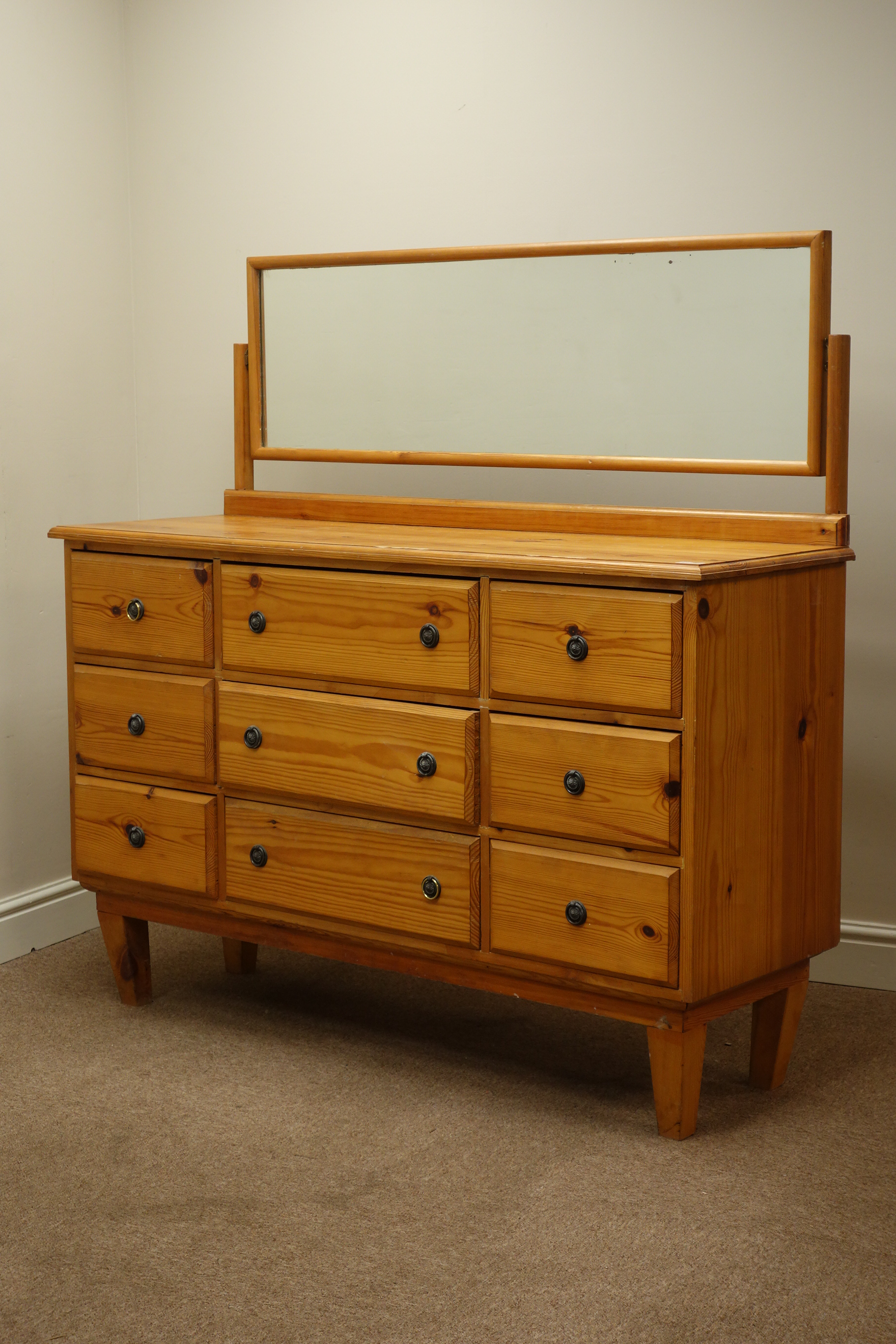 Pine dressing chest fitted with nine drawers and swing mirror (W135cm, H135cm, D45cm),