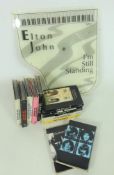 Collection of Beatles single cassette tapes in card cases and an Elton John,