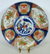 Japanese Arita porcelain polychrome charger decorated with flowers and birds.