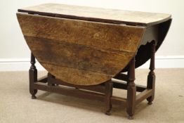 Early 18th century oak drop leaf dining table, turned double gate leg base, 118cm x 146cm,