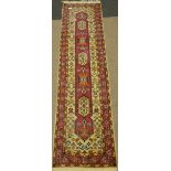 Persian cream and pink runner rug, long central lozenge, with stylized decoration,