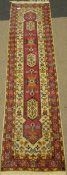 Persian cream and pink runner rug, long central lozenge, with stylized decoration,