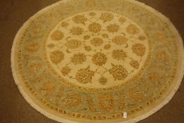 Pakistan Khyber circular wool rug, beige ground with green border,