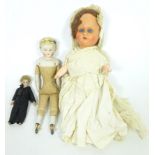 Three 19th/ early 20th Century dolls;
