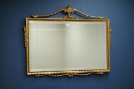 Gilt framed rectangular wall mirror with bevelled plate and urn cresting.
