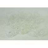 Set of seven Stuart crystal barrel shaped tumblers and set of six smaller barrel shaped glasses -