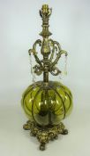 Gilt metal and green glass table lamp with glass lustres and shade,