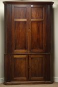 Early 19th century mahogany double corner cupboard enclosed by four panelled doors, W130cm,