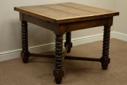 Early 20th century oak drawer leaf dining table on bobbin turned legs, X shaped under-stretcher,
