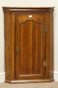 19th century oak wall hanging corner cupboard enclosed by single panelled door, W67cm,