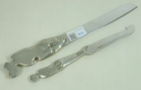 Carrol Boyes bread knife with nude cast handle and a similar cheese knife,