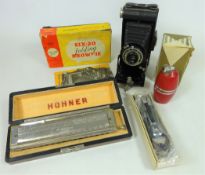 Honer 'The 64 Chronomonica' by Hohner in case, a Brownie Six-20 folding camera in box,